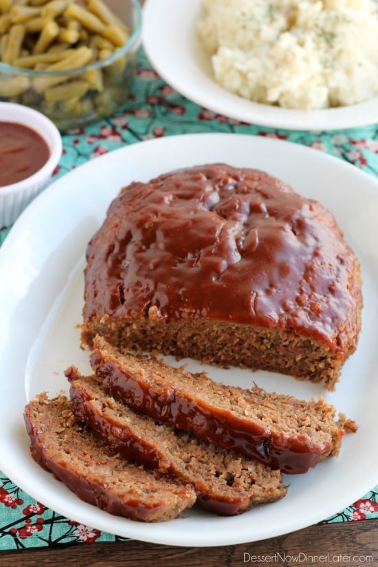 This Slow Cooker Meatloaf has a delicious savory-sweet brown sugar and balsamic glaze on top, and is cooked on a sheet of parchment paper that easily lifts the meatloaf out of the slow cooker when it's done cooking.