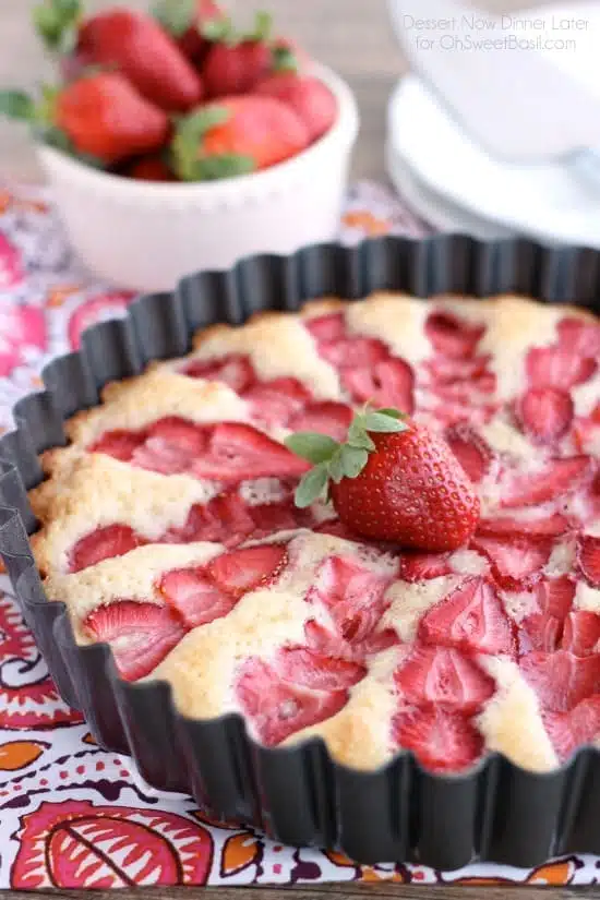 This Strawberry Cake is lightly sweet, layered with fresh sliced strawberries, and is served with a side of coconut whipped cream. A stunning and delicious dessert for any occasion or Valentine's Day.