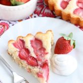 This Strawberry Cake is lightly sweet, layered with fresh sliced strawberries, and is served with a side of coconut whipped cream. A stunning and delicious dessert for any occasion or Valentine's Day.