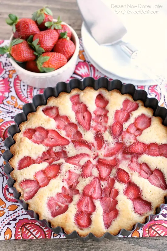This Strawberry Cake is lightly sweet, layered with fresh sliced strawberries, and is served with a side of coconut whipped cream. A stunning and delicious dessert for any occasion or Valentine's Day.