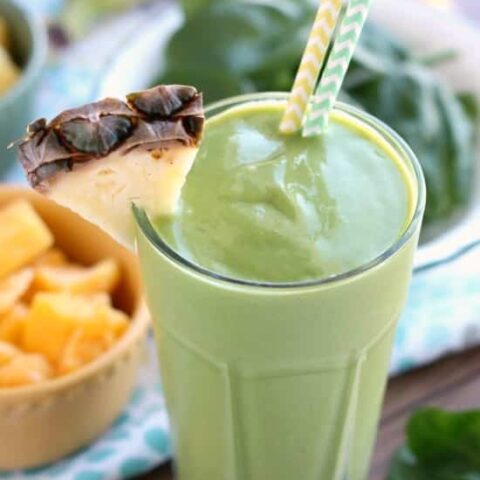 This Tropical Green Smoothie uses tender spinach leaves, plain non-fat greek yogurt, and frozen fruit for a naturally sweet smoothie that's great for breakfast or a snack!