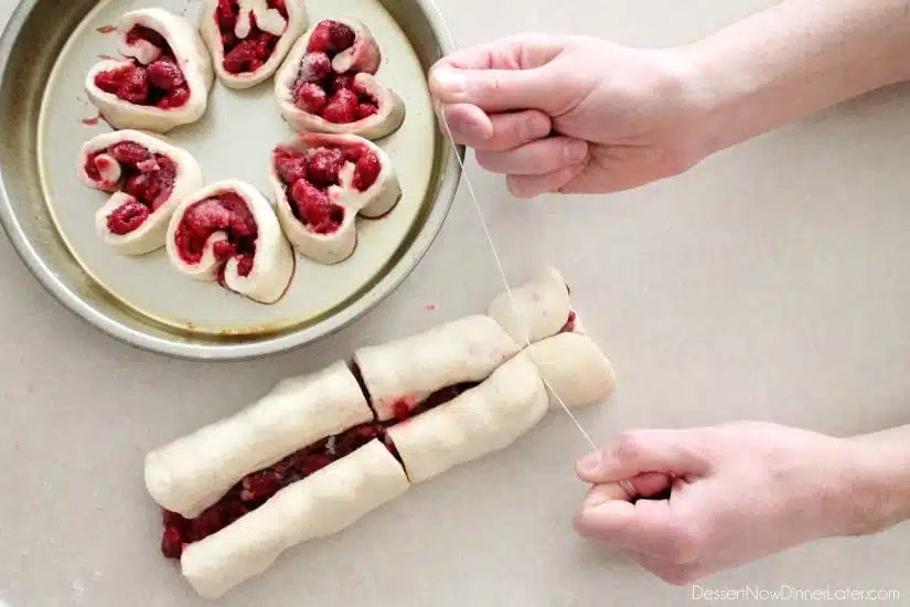 Cutting rolls with dental floss.