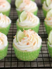 These Coconut Lime Cupcakes are the perfect mix of tropical and citrus flavors, with a lime and coconut cupcake base, coconut cream cheese frosting, and toasted coconut on top!