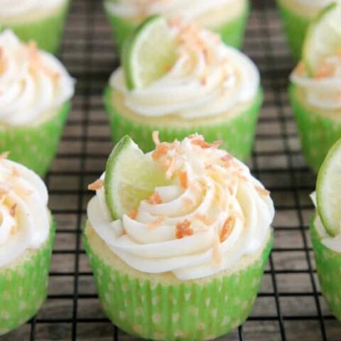 These Coconut Lime Cupcakes are the perfect mix of tropical and citrus flavors, with a lime and coconut cupcake base, coconut cream cheese frosting, and toasted coconut on top!