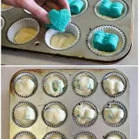 These Gender Reveal Cupcakes have pink, blue, and white swirled frosting on top that hides the secret colored heart in the center of the cupcake revealing the baby's gender when you bite into it! (Step-by-Step Photo Tutorial)