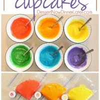 These Rainbow Cupcakes are made with a simple boxed white cake mix, colored, and layered to make a rainbow, with whipped cream cheese frosting on top!