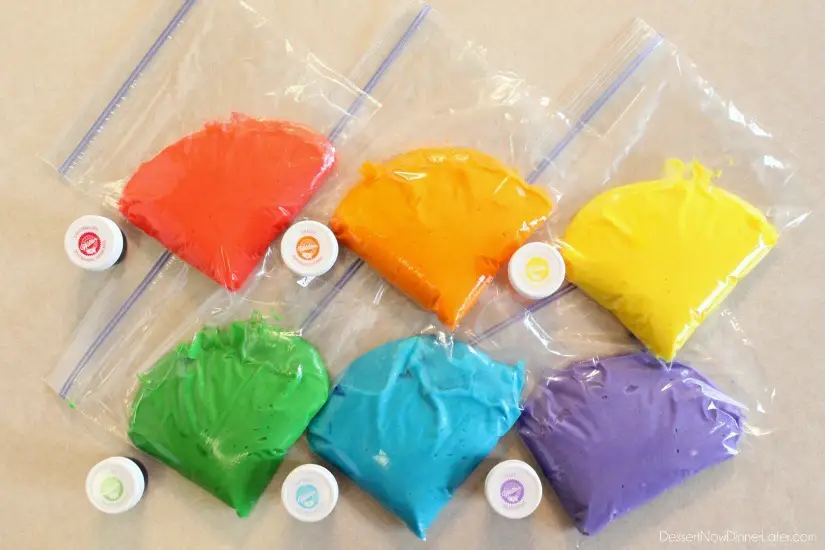 Rainbow Cupcake Batter in sandwich bags to pipe into cupcake liners.