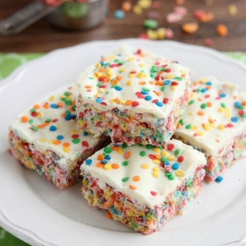 Fruity Pebbles, marshmallows, white chocolate, and confetti sprinkles, come together to make these Rainbow Krispie Treats! An easy St. Patrick's Day dessert!