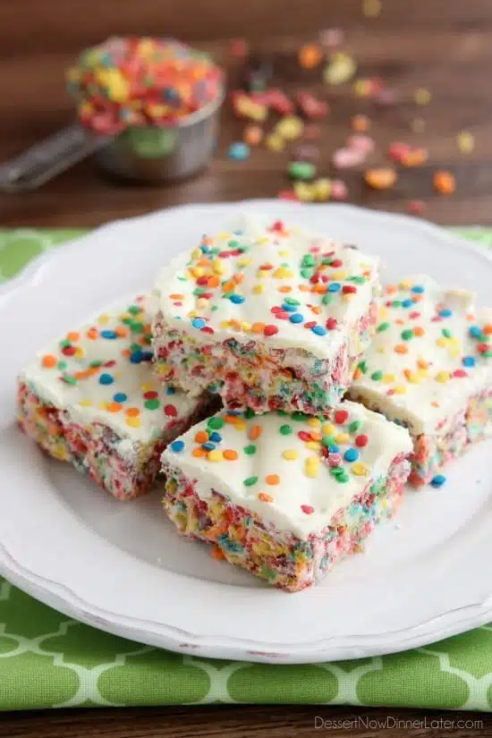 Fruity Pebbles, marshmallows, white chocolate, and confetti sprinkles, come together to make these Rainbow Krispie Treats! An easy St. Patrick's Day dessert!