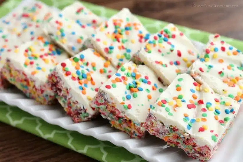 Fruity Pebbles, marshmallows, white chocolate, and confetti sprinkles, come together to make these Rainbow Krispie Treats! An easy St. Patrick's Day dessert!