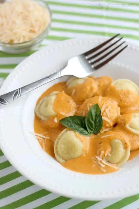 Roasted Red Pepper Ravioli - Fresh and creamy roasted red pepper sauce atop al dente cooked cheese filled ravioli, for a restaurant-quality Italian dish made easy at home!