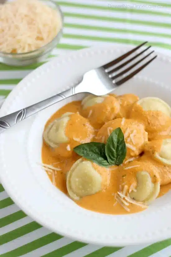 Roasted Red Pepper Ravioli - Fresh and creamy roasted red pepper sauce atop al dente cooked cheese filled ravioli, for a restaurant-quality Italian dish made easy at home!