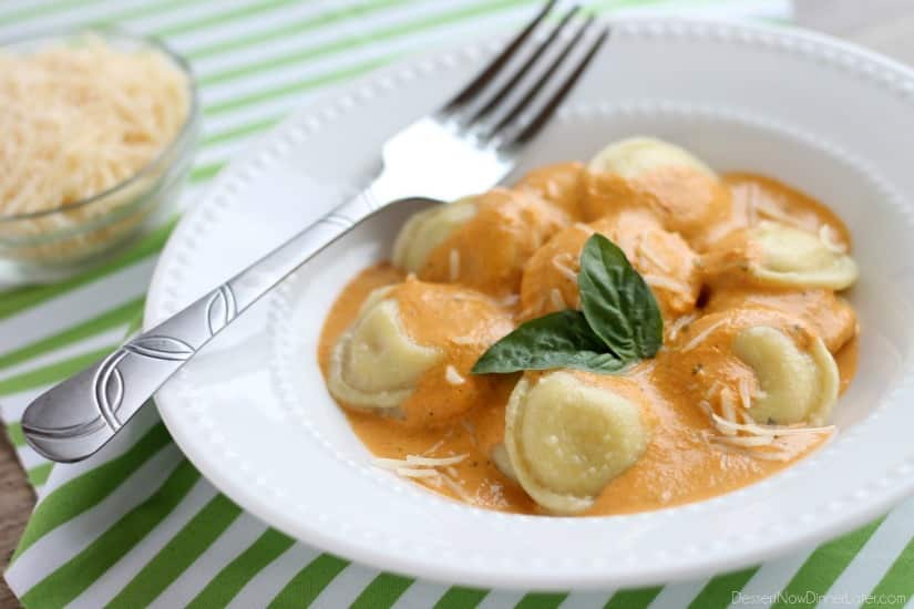 Roasted Red Pepper Ravioli - Fresh and creamy roasted red pepper sauce atop al dente cooked cheese filled ravioli, for a restaurant-quality Italian dish made easy at home!