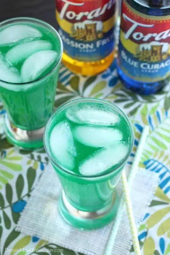 Xanadew - this FIIZ soda shop copycat drink recipe uses blue curacao and passion fruit syrups mixed into Mountain Dew for a fun green tropical mocktail!