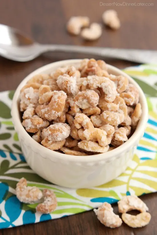 These Coconut Cashews, inspired by Trader Joe's, are made with coconut milk, coconut oil, sugar, and coconut flakes to create some incredibly delicious candied nuts!