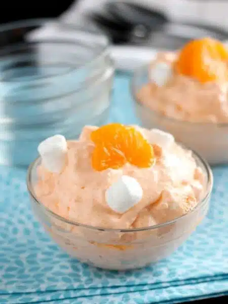 This Orange Fluff Fruit Salad can be thrown together quick, with only 6 to 7 ingredients, and is a potluck favorite!