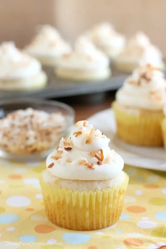 These Pina Colada Cupcakes have crushed pineapple in the cake, and coconut & rum extracts in the frosting, for a frozen drink inspired tropical dessert!