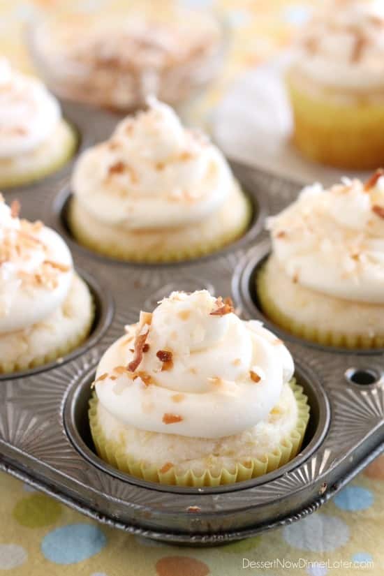 These Pina Colada Cupcakes have crushed pineapple in the cake, and coconut & rum extracts in the frosting, for a frozen drink inspired tropical dessert!