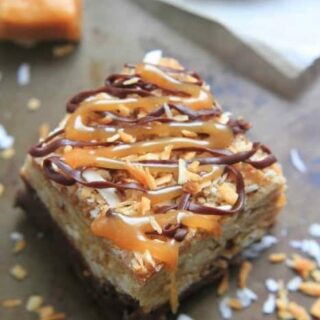 Samoa Oatmeal Cookie Bars - These soft oatmeal cookie bars combine the beloved caramel, chocolate and coconut flavors of the Samoa Girl Scout cookies.