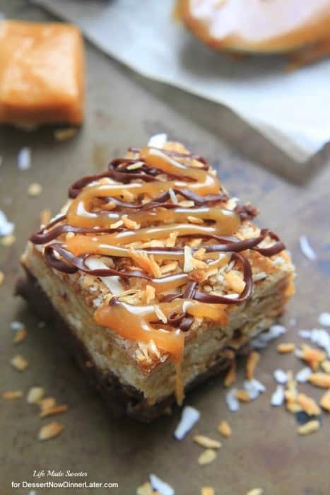 Samoa Oatmeal Cookie Bars - These soft oatmeal cookie bars combine the beloved caramel, chocolate and coconut flavors of the Samoa Girl Scout cookies.