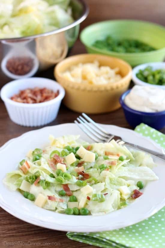 Sarah's Salad from Utah's Lion House restaurant uses crisp iceberg lettuce, peas, bacon, green onions, and swiss cheese tossed in a simple, sweet dressing.