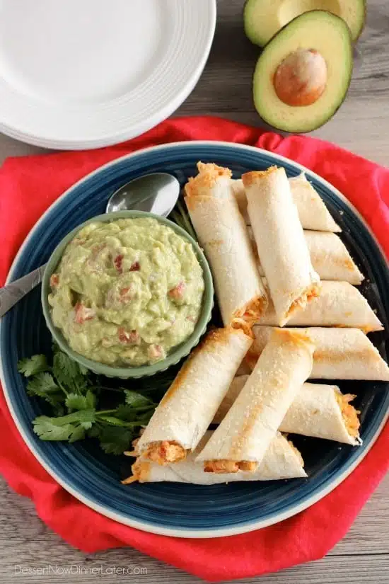 These Zesty Baked Chicken Taquitos are creamy and cheesy with a special ingredient to make them bold and zesty!  A simple guacamole recipe is also included! 