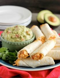 These Zesty Baked Chicken Taquitos are creamy and cheesy with a special ingredient to make them bold and zesty! A simple guacamole recipe is also included!