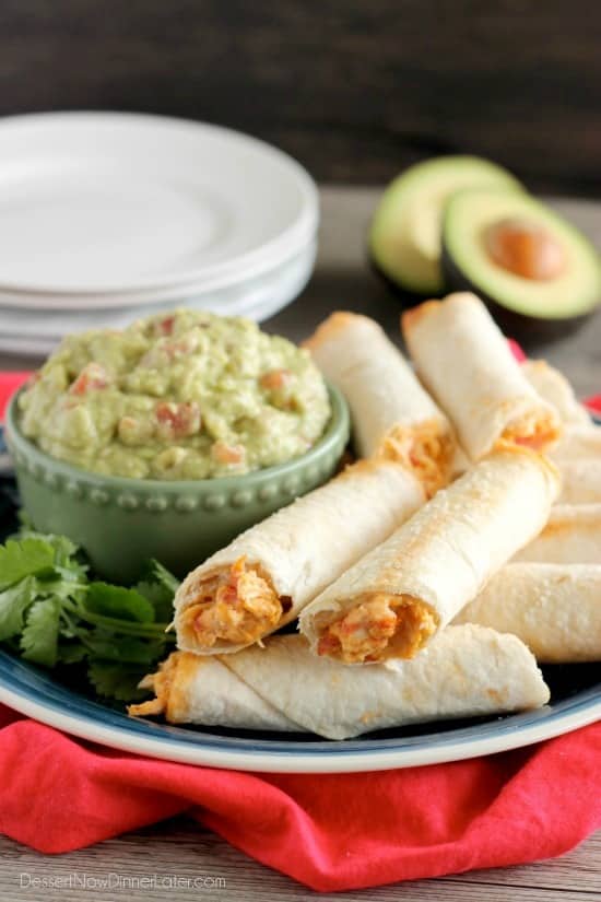 These Zesty Baked Chicken Taquitos are creamy and cheesy with a special ingredient to make them bold and zesty! A simple guacamole recipe is also included!