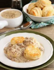 Biscuits and Gravy - a simple and spicy peppered sausage gravy atop flaky, foolproof buttermilk biscuits makes for a great breakfast or brunch!
