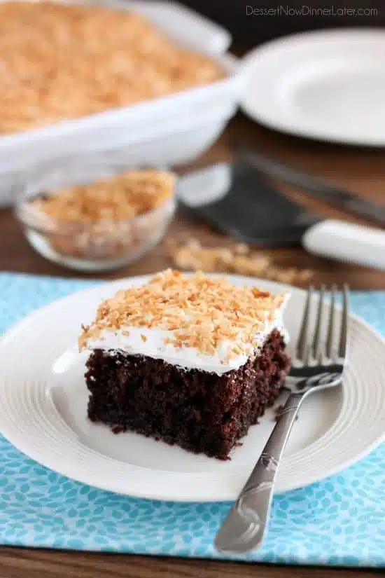 Coconut Cream Chocolate Poke Cake - an easy box cake makeover with cream of coconut, toasted coconut, and whipped cream!