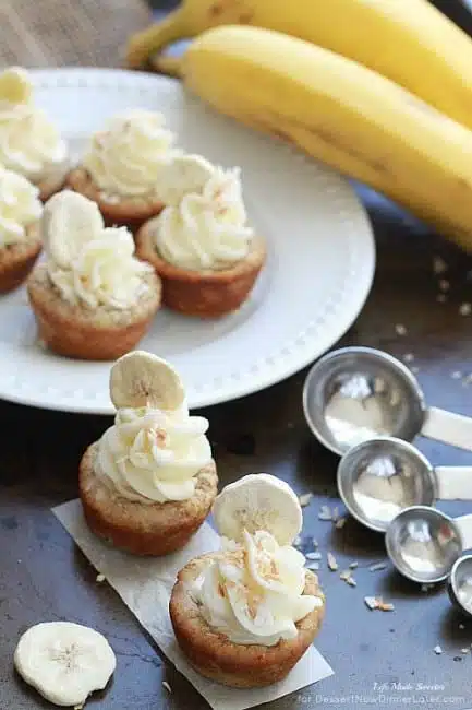 Banana Coconut Mini Cookie Cups - Tropical inspired coconut cookie cups filled with sliced bananas and topped with a swirled coconut buttercream frosting.