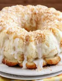 Pina Colada Monkey Bread - toasted coconut, crushed pineapple, and a secret ingredient combine together to make this sticky pull apart bread a tropical treat!