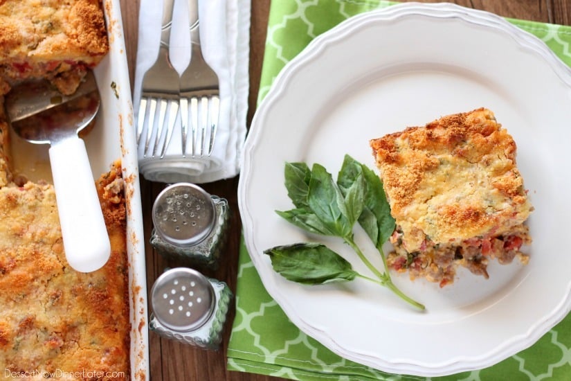 Savory Breakfast Bread Pudding has sausage, tomatoes, eggs, and herbs all in a cheesy bread pudding.