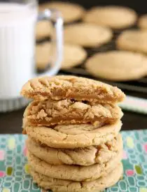 These Thick and Chewy Peanut Butter Cookies are slightly crisp on the outside, tender and soft on the inside, plus you just scoop and bake them! No rolling in sugar and pressing with a fork required!