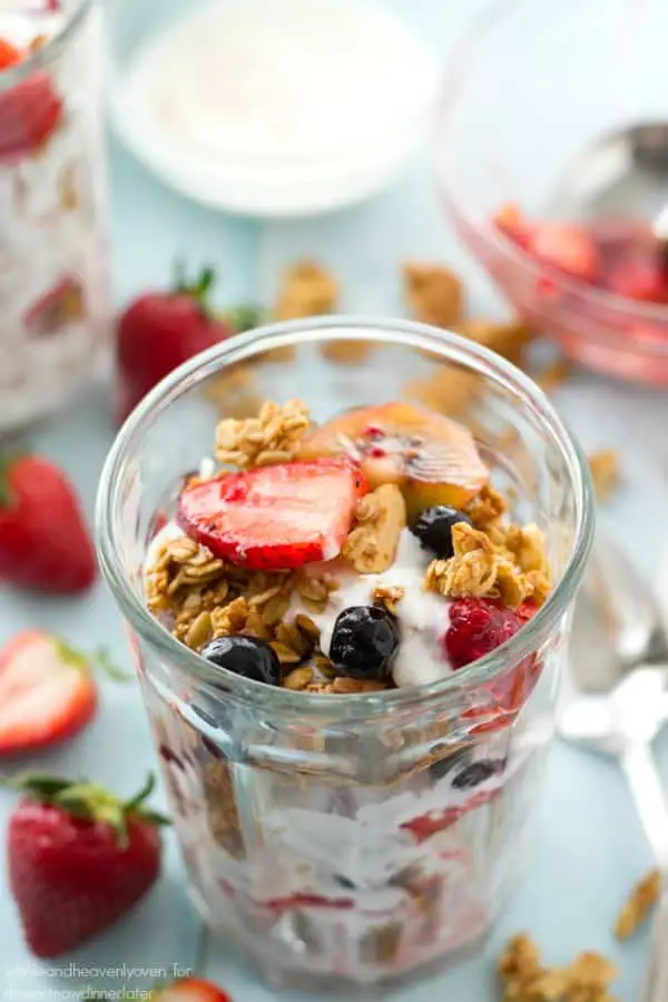 These pretty granola parfaits are loaded with a triple-delight of juicy berries, crispy granola, and the best coconut yogurt you'll ever taste. Destined to become your new go-to breakfast!