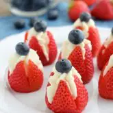Try these easy red, white, and blue Cheesecake Stuffed Strawberries for a healthier patriotic dessert!