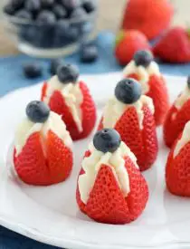 Try these easy red, white, and blue Cheesecake Stuffed Strawberries for a healthier patriotic dessert!