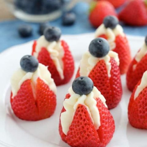 Try these easy red, white, and blue Cheesecake Stuffed Strawberries for a healthier patriotic dessert!