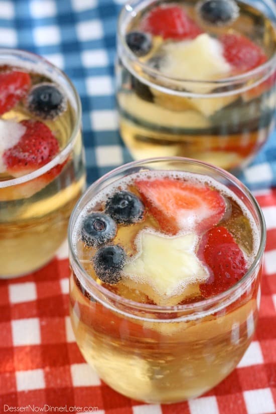 This Patriotic Punch is a fizzy drink made easy with only two ingredients and decorated with fruit for a red, white, and blue, party punch the whole family can enjoy!