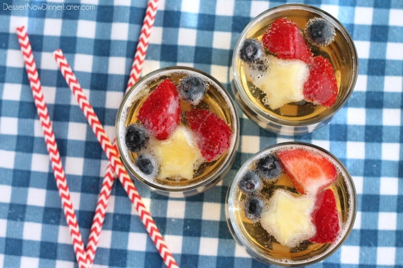 This Patriotic Punch is a fizzy drink made easy with only two ingredients and decorated with fruit for a red, white, and blue, party punch the whole family can enjoy!