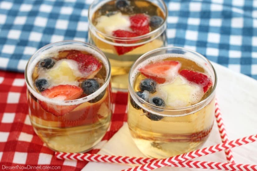 This Patriotic Punch is a fizzy drink made easy with only two ingredients and decorated with fruit for a red, white, and blue, party punch the whole family can enjoy!