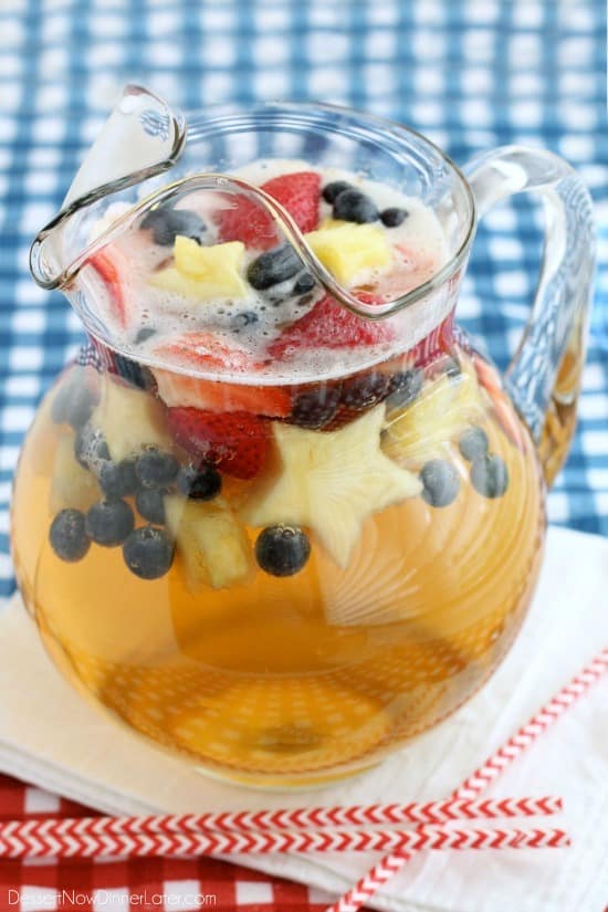 This Patriotic Punch is a fizzy drink made easy with only two ingredients and decorated with fruit for a red, white, and blue, party punch the whole family can enjoy!