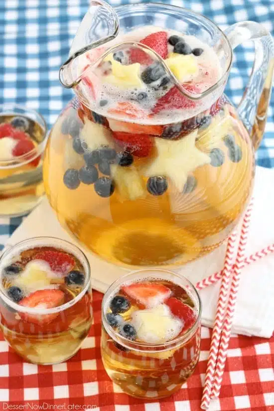 This Patriotic Punch is a fizzy drink made easy with only two ingredients and decorated with fruit for a red, white, and blue, party punch the whole family can enjoy!