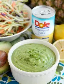 This Pineapple Avocado Dressing is made with DOLE pineapple juice, fresh herbs, and a ripe avocado, for a creamy dressing great on kale or broccoli slaw!