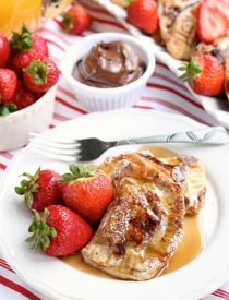 Fresh strawberries and Nutella are hidden inside this Stuffed French Toast recipe that's easy enough for the kids to help make!