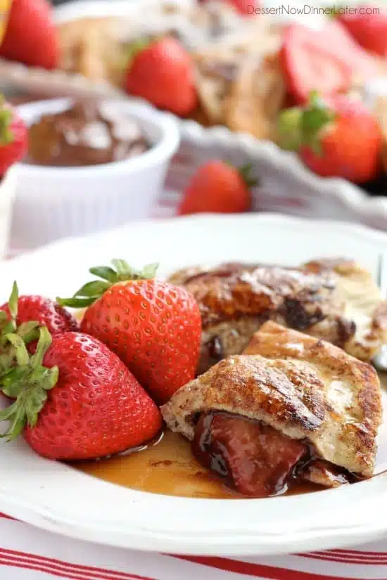 Fresh strawberries and Nutella are hidden inside this Stuffed French Toast recipe that's easy enough for the kids to help make!