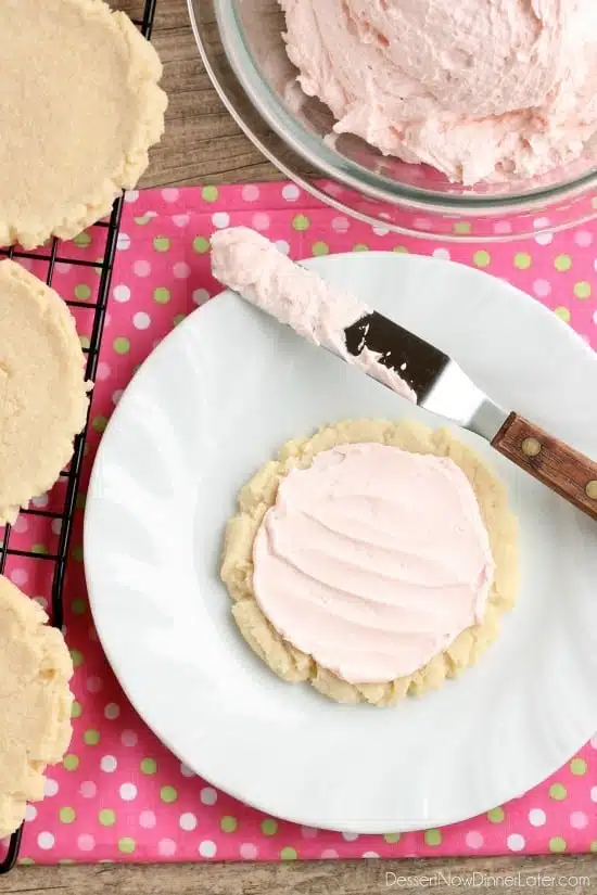 The ingredients list might surprise you with these scoop, press, and bake rustic-looking sugar cookies.  With a soft, sweet, melt-in-your-mouth cookie base, topped with a smooth and dreamy buttercream frosting -- these really are the BEST sugar cookies you will make at home!