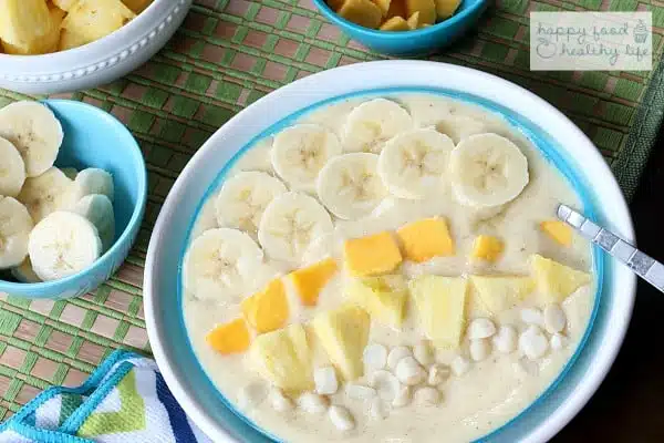 This tropical smoothie bowl is perfect for when you want the flavors of a smoothie but don't necessarily want to drink your breakfast. And the flavors will take you right to the beach!