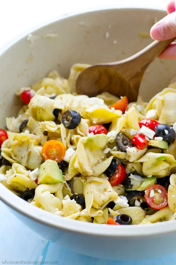 Bring this super-fresh tortellini salad to any picnic and watch it disappear! Loaded with a rainbow of Mediterranean ingredients and tossed in a tangy citrus balsamic dressing. @WholeHeavenly
