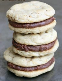 Chewy Peanut Butter Cookies are sandwiched between a simple Fudge Frosting to create an ultimate peanut butter chocolate cookie worth devouring!